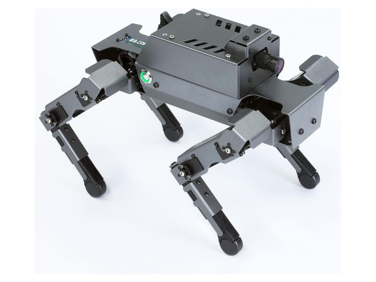 Grauer Roboterhund DOGZILLA S1 aus Aluminium von schräg oben, mit Kamera am Kopfende, grün leuchtendem Einschaltknopf und kleiner Anzeige am Rücken.