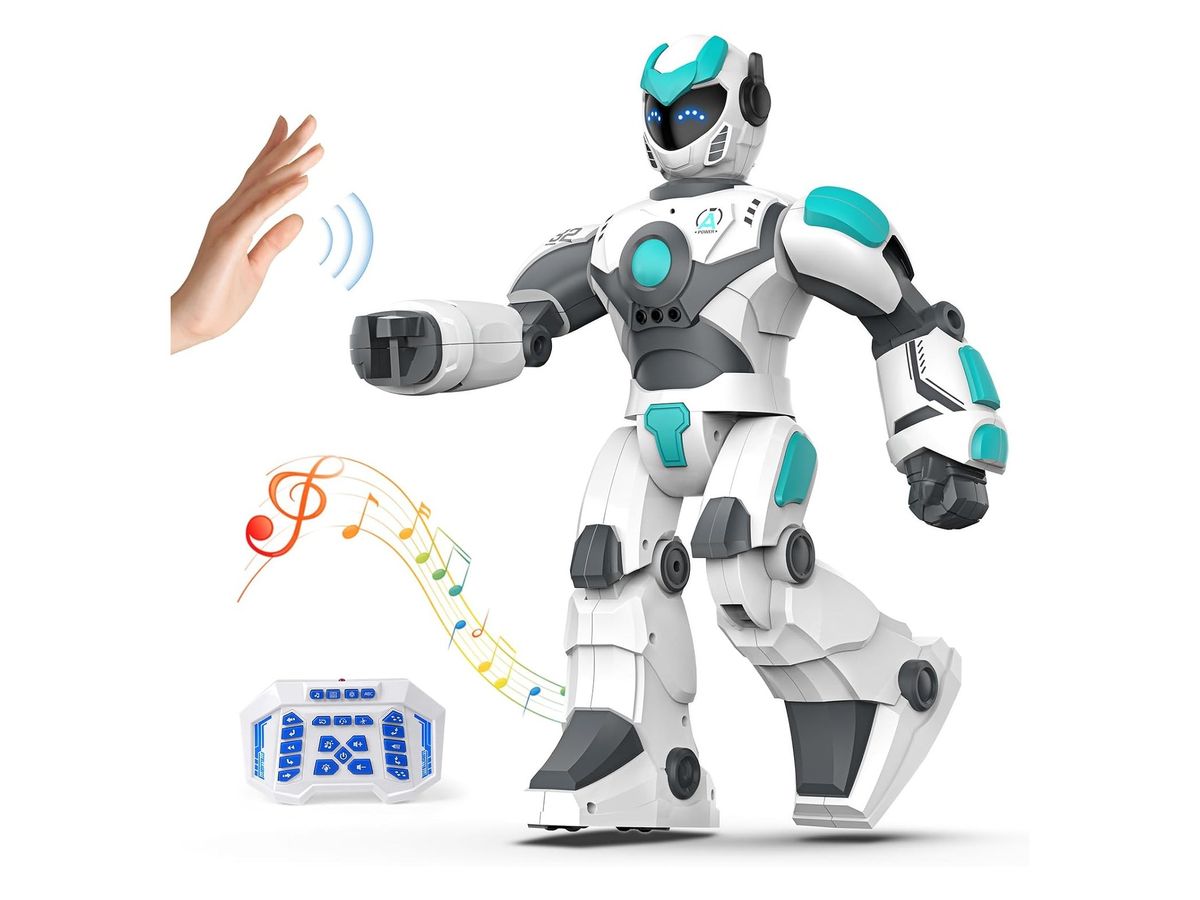 Weiß-grauer humanoider Spielroboter mit türkisfarbenen Akzenten im Schritt, links eine winkende Hand, unten eine blaue Fernbedienung