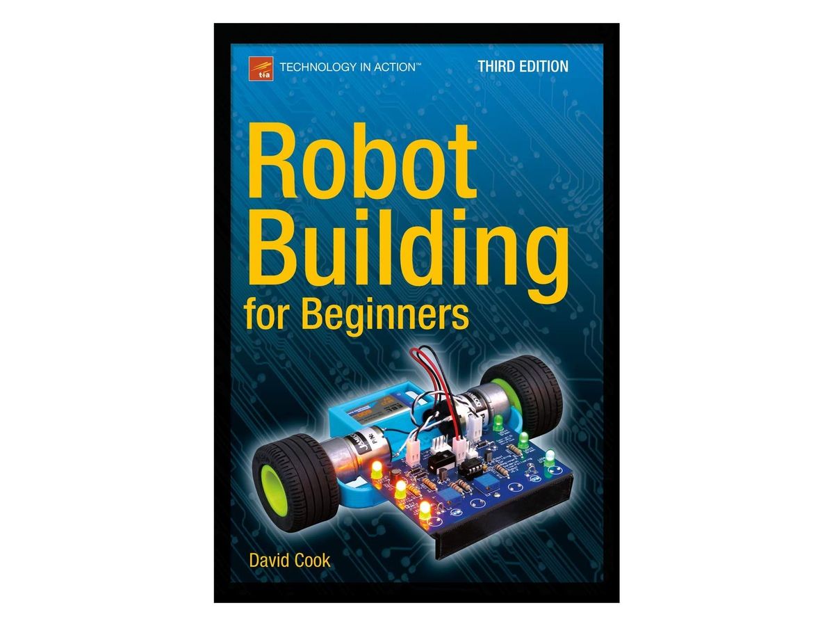 Blaues Buchcover mit gelbem Titel „Robot Building for Beginners“, oben „Technology in Action“ und „Third Edition“, darunter das Foto eines kleinen Zweirad-Roboters mit grünen Rädern, Platine und leuchtenden LEDs, unten „David Cook“