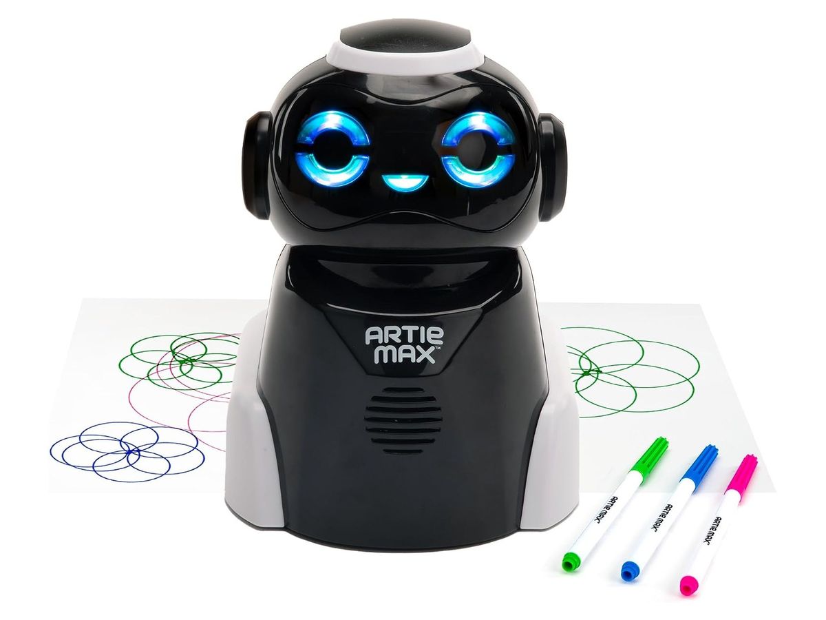 Schwarz-weißer Zeichenroboter Artie Max mit blau leuchtenden Augen auf einem Blatt mit bunten Kreismustern, daneben drei Farbstifte in Grün, Blau und Pink.