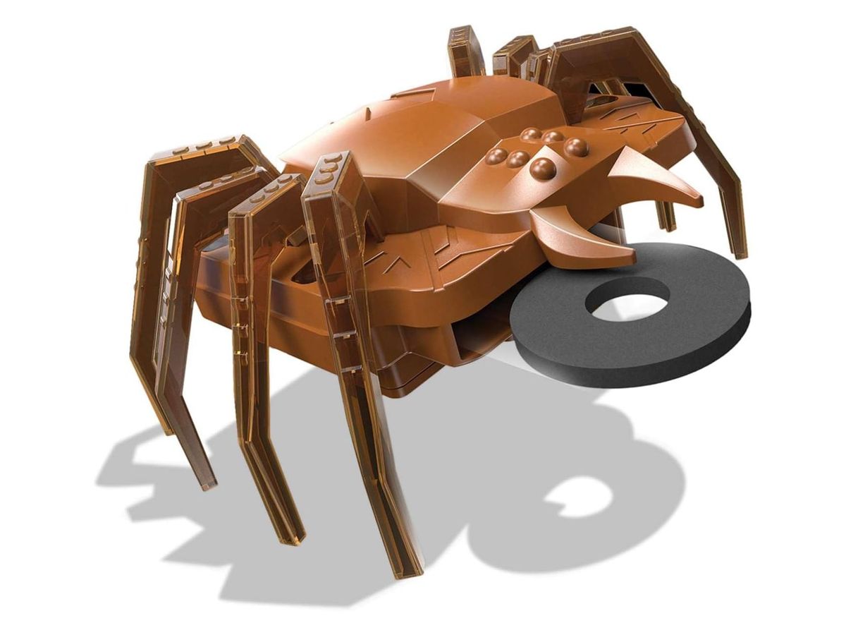 Kupferfarbener SpiderBot mit acht durchscheinenden Beinen, aus dessen Körper eine schwarze Schaumstoffscheibe ragt.